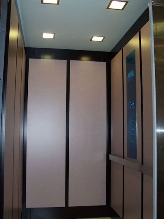 The inside of an elevator.