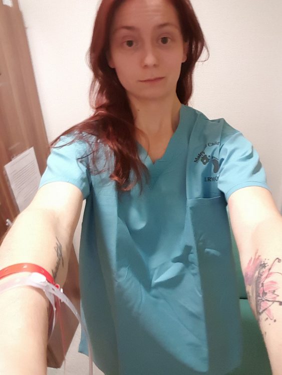 woman selfie in a hospital gown