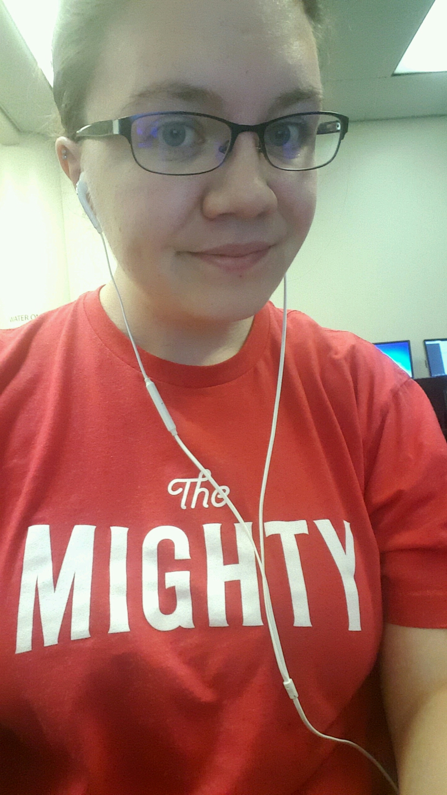 Alaura wearing red t-shirt with The Mighty logo