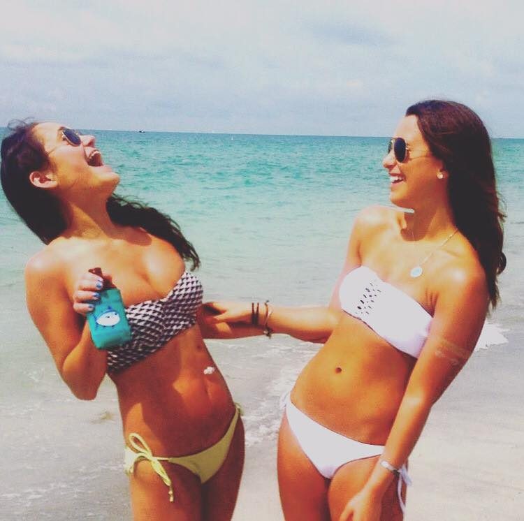mady marks and friend at beach laughing
