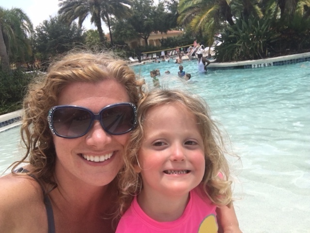 The author and her daughter at a pool