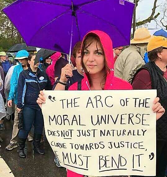 woman holding protest sign