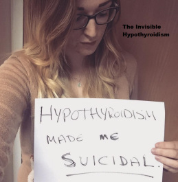 A woman holds a sign saying that her medical condition made her suicidal.