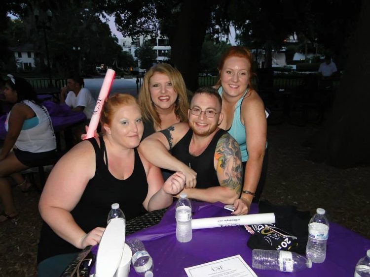 woman with three grown daughters at fundraiser