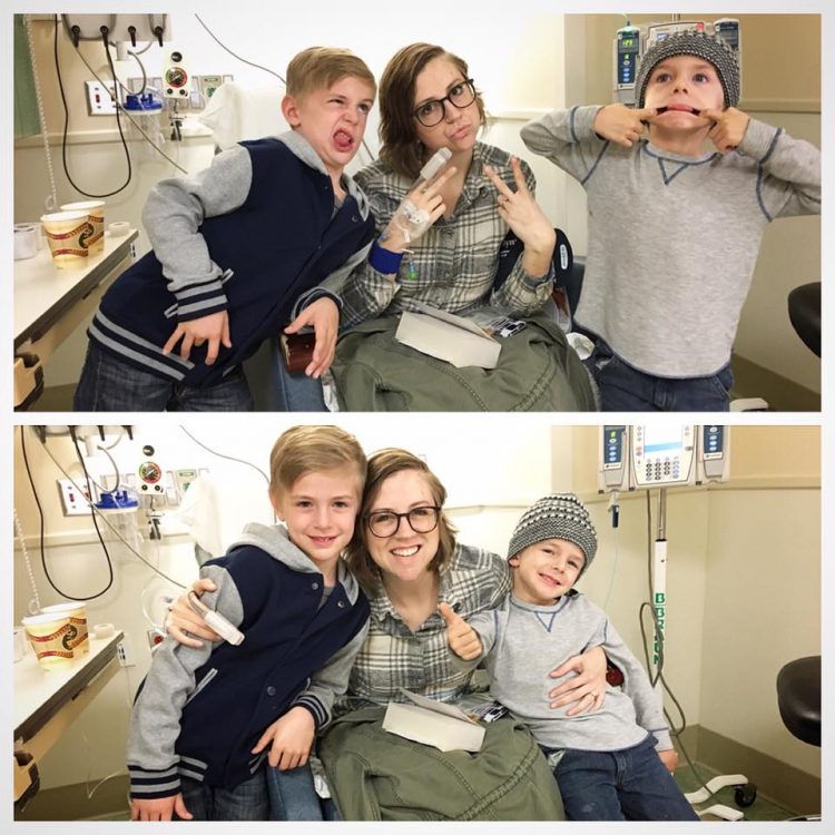 woman in hospital bed with two young boys making silly faces