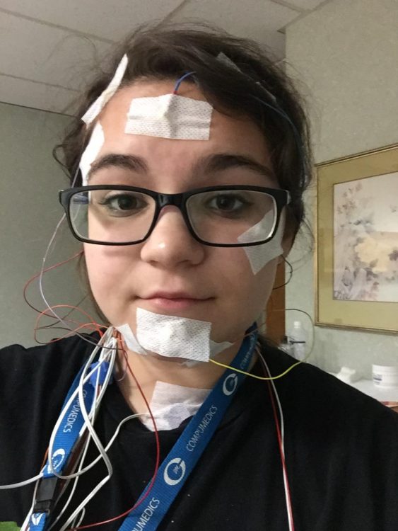 woman with monitors and wires on her face