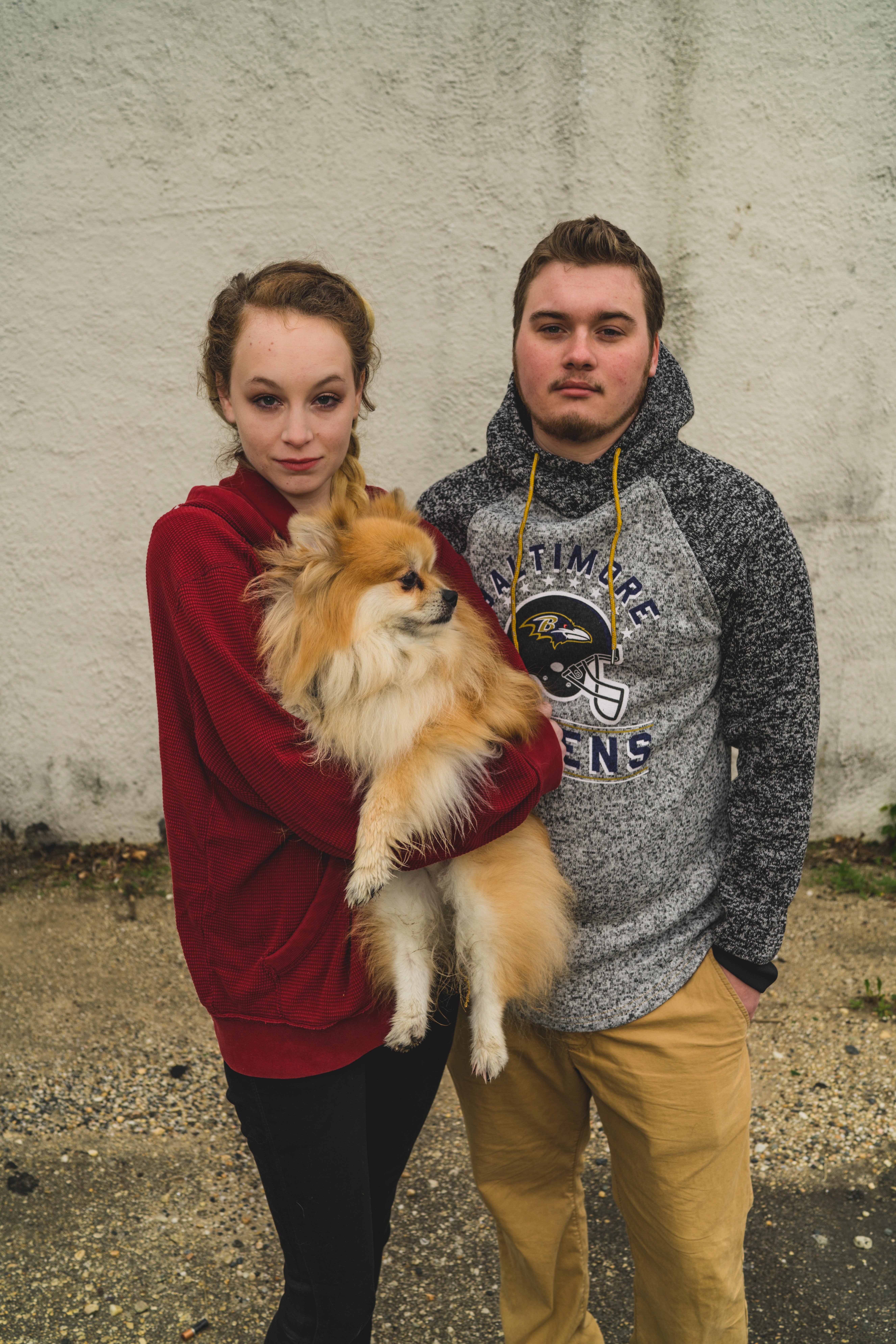 woman standing with dog and boyfriend