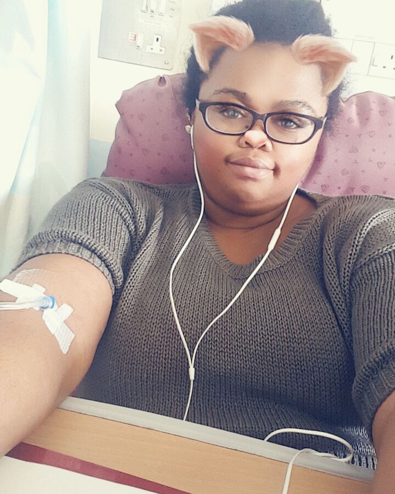 selfie of a woman with an iv in her arm