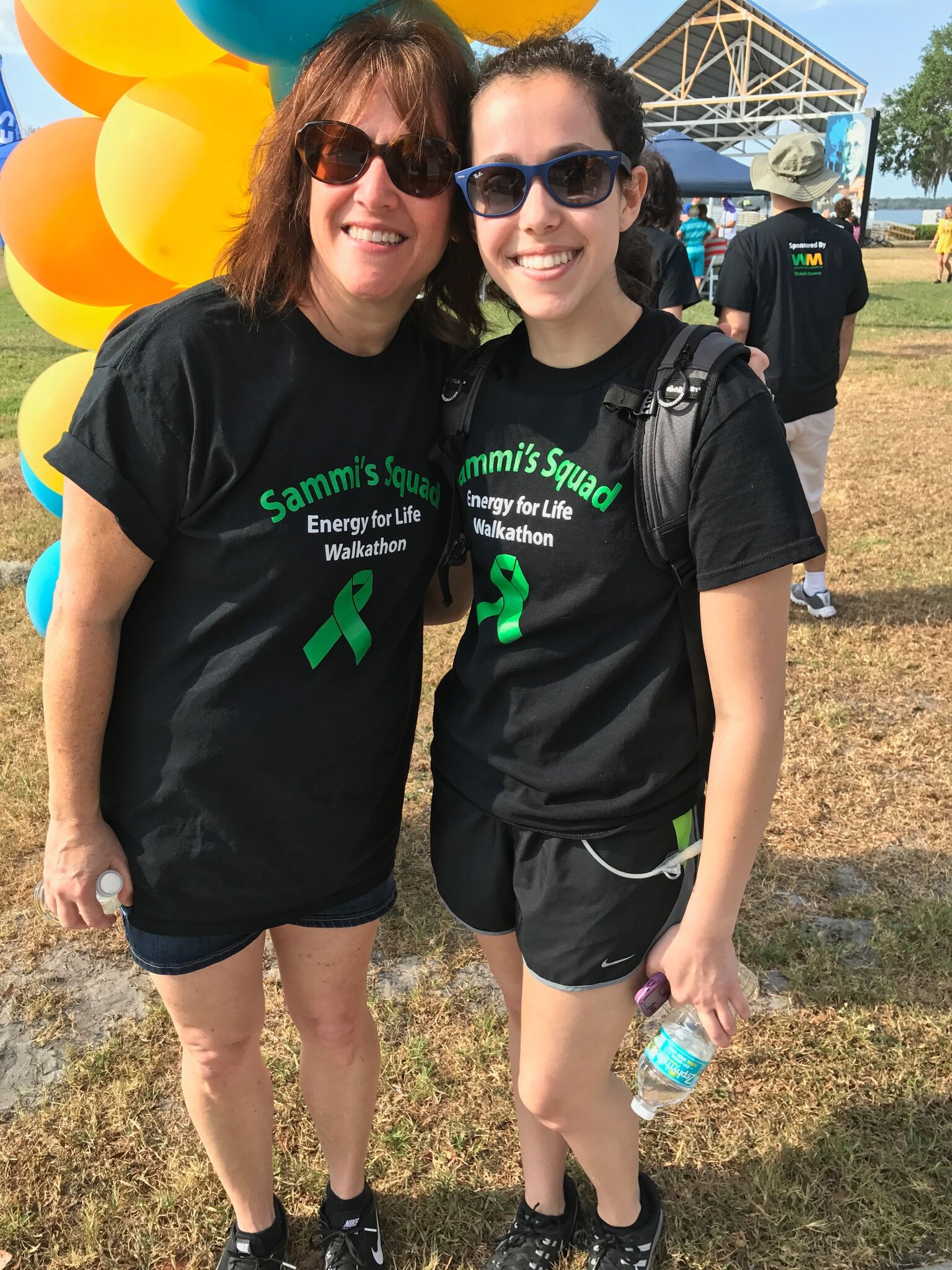 mother and daughter in matching t-shirts at a race