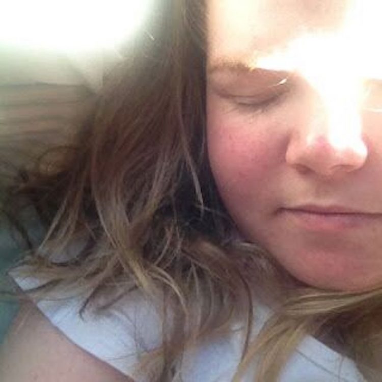 young woman sleeping in the sun