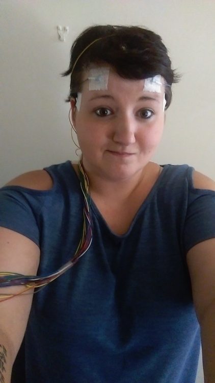 woman with wires attached to her forehead