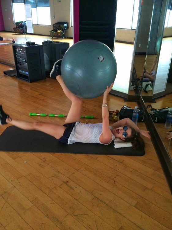 woman doing core exercises on the floor in physical therapy