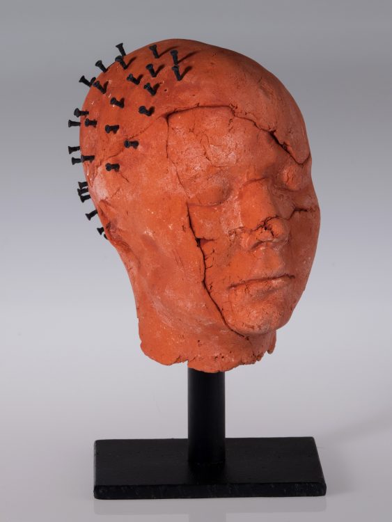 ceramic head with screws in skull
