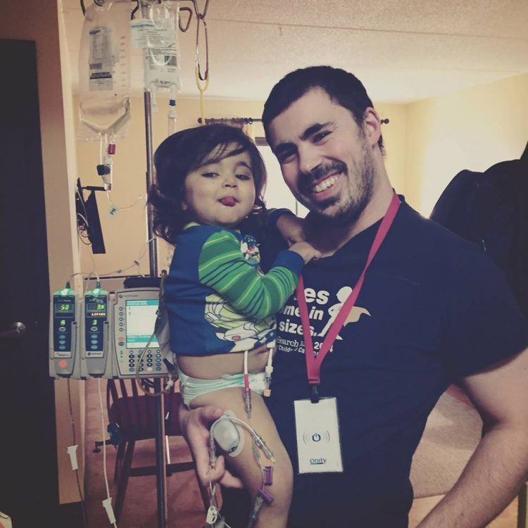 dad holding young son before transplant