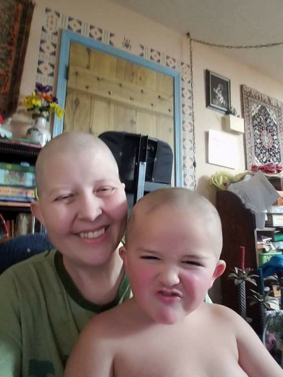 woman and son with bald, shaved heads