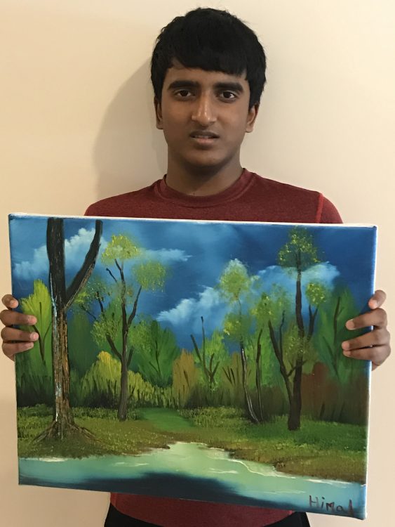 Himal Bikmal with his painting of a forest