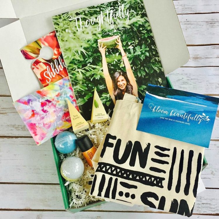 Beach themed box containing tote, body spray, and book