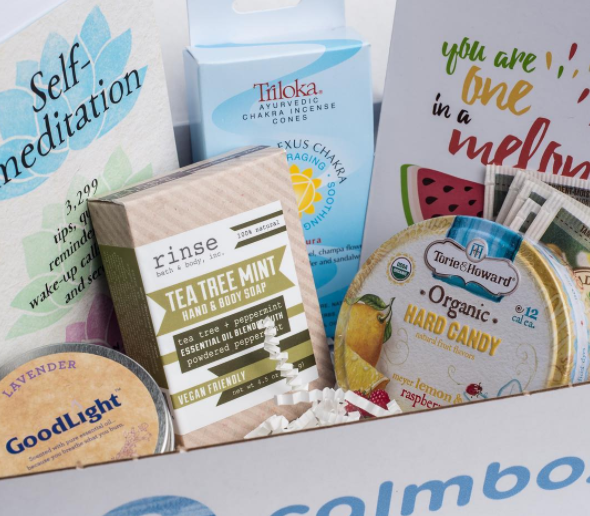 calmbox containing tea, food, and prints