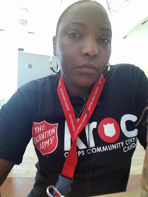 woman at work wearing a salvation army shirt