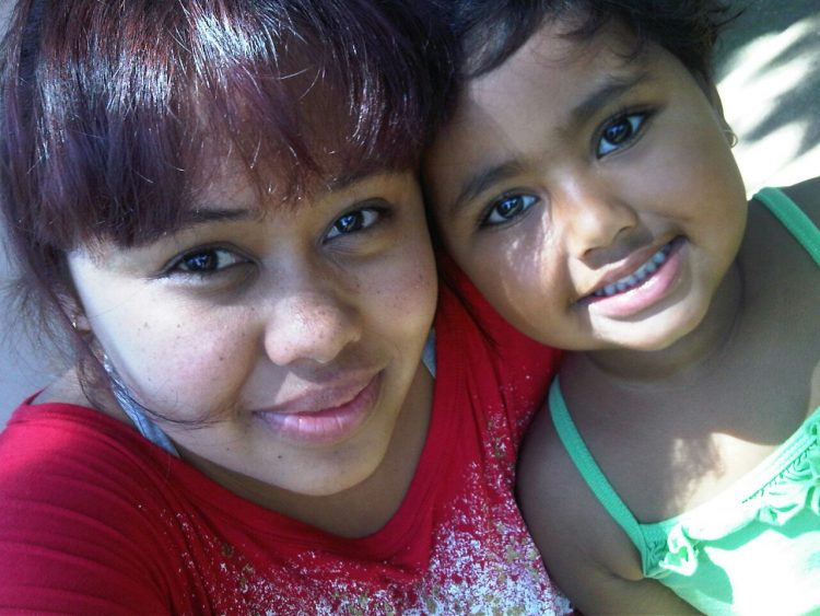 woman smiling with her daughter