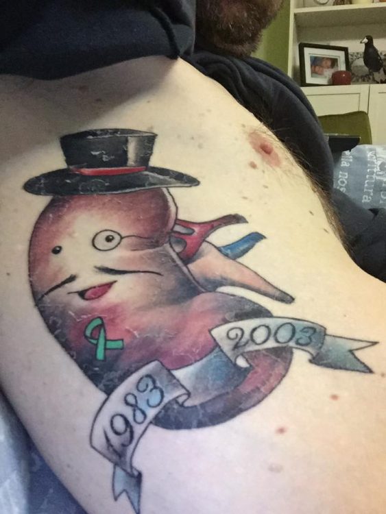 man with tattoo on his side representing his kidney failure