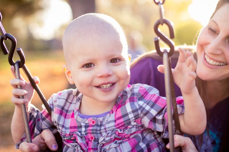 young cancer patient on swing