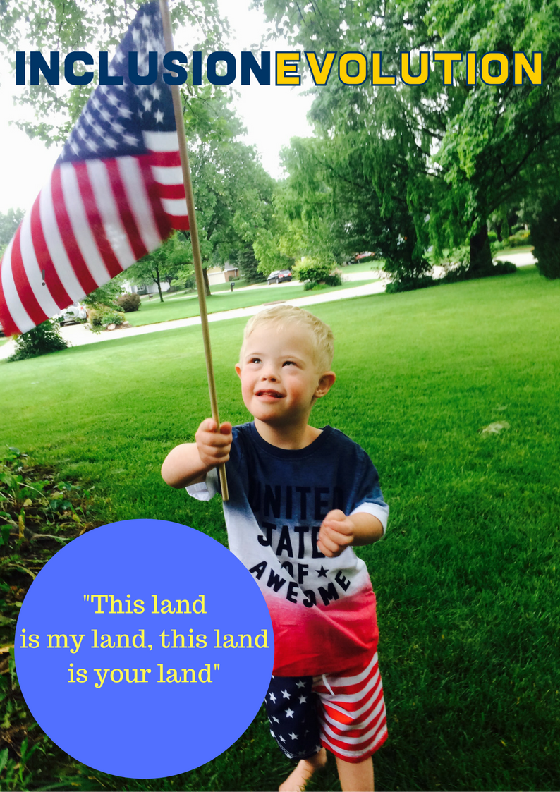 Troy, a little boy with Down syndrome holding an American flag.