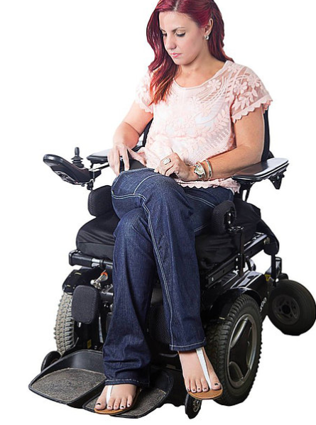 Woman in wheelchair wearing adaptable jeans from alter ur ego