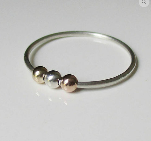 silver fidget ring with gold, silver, and pink beads, by Love Dawne