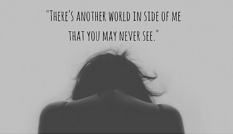 black and white image of a woman's shoulders and hair with text that says 'there's another world inside of me that you may never see'