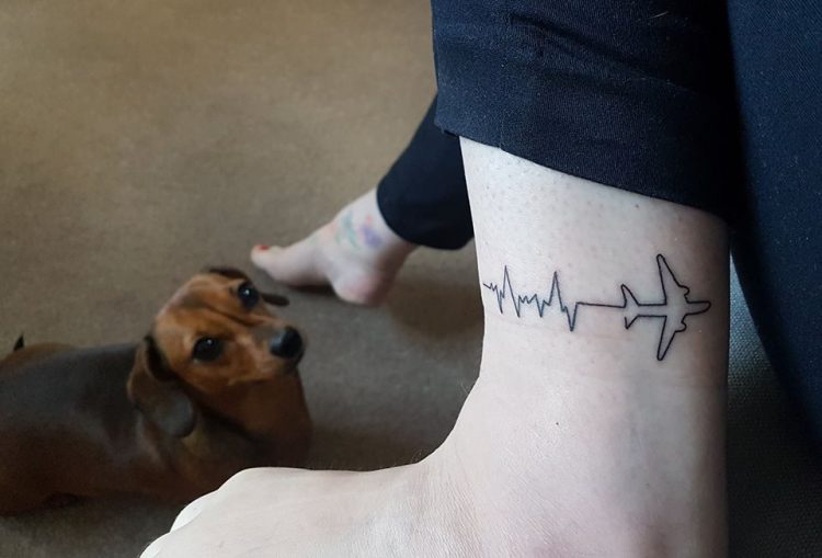 heartbeat tattoo with airplane
