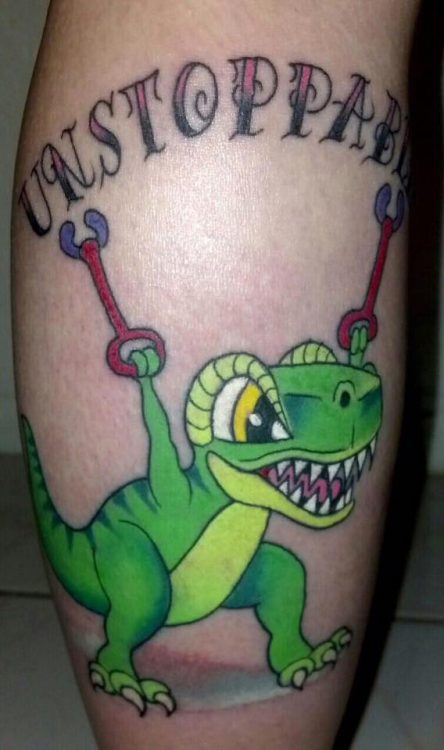 tattoo of t-rex holding walkers with text 'unstoppable'