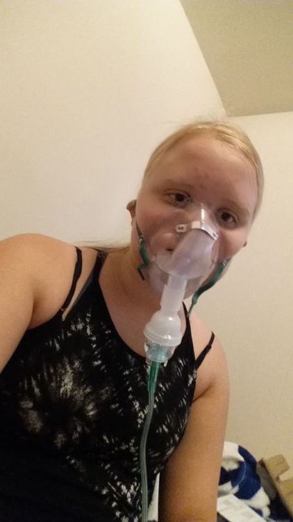 woman wearing a nebulizer