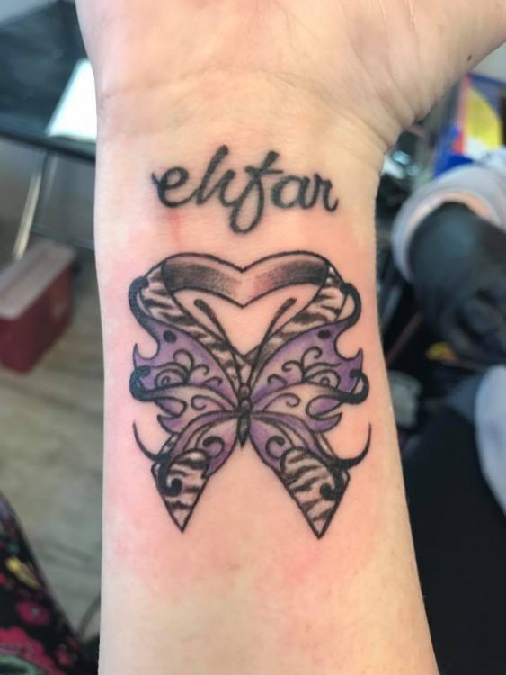 tattoo with acronym 'EHFAR' with butterfly and zebra awareness ribbon