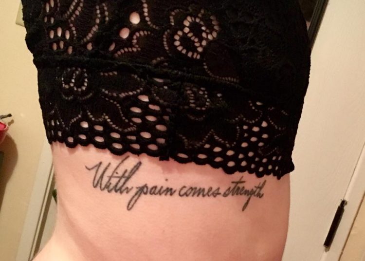 tattoo that says 'with pain comes strength'