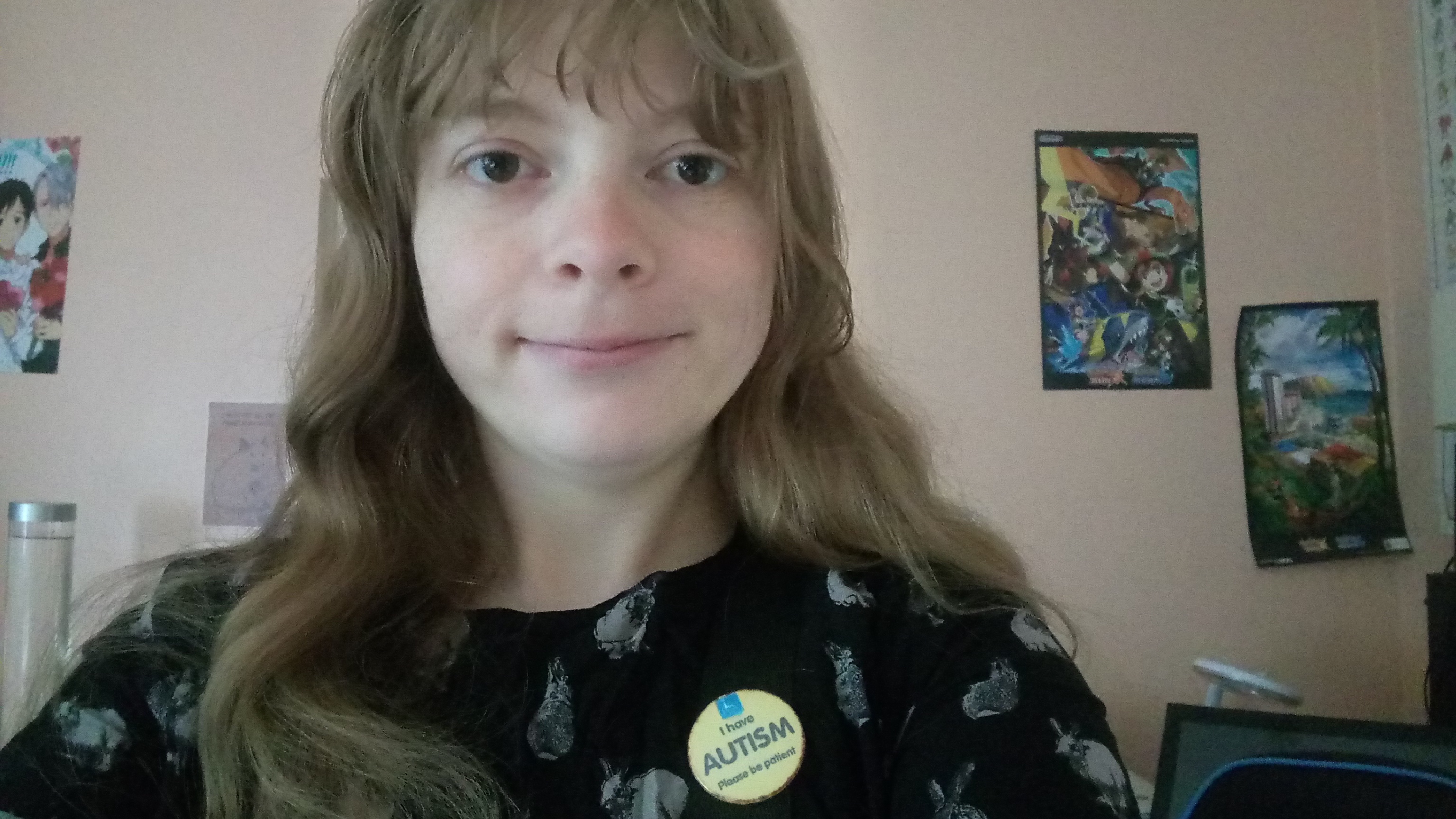 Lucy wearing her autism badge.