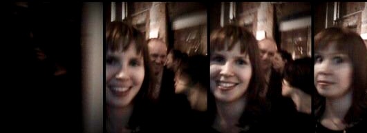 A photo of the writer at an event, with a slightly blurry affect.