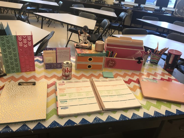 teacher's desk with lesson plans