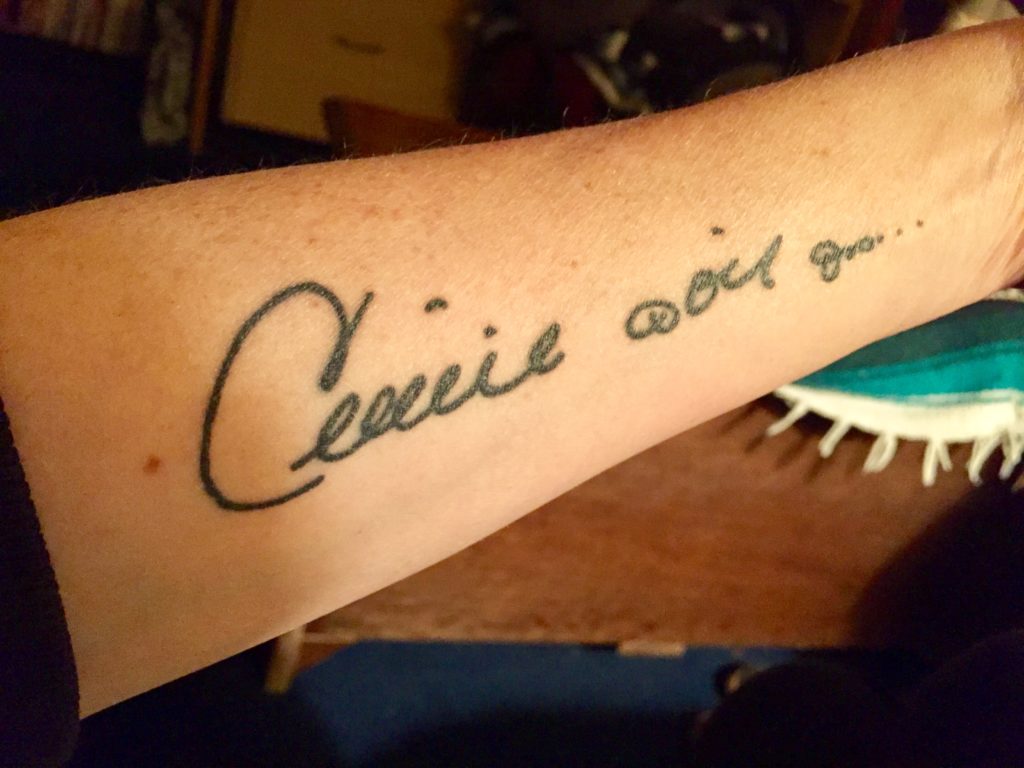 Celine Dion autograph tattoo on woman's arm