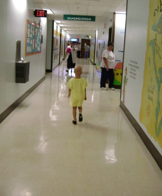Lily walking down hall of hospital
