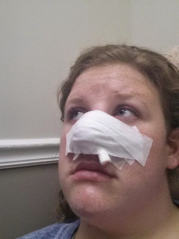 woman with bandage on face after skin cancer surgery