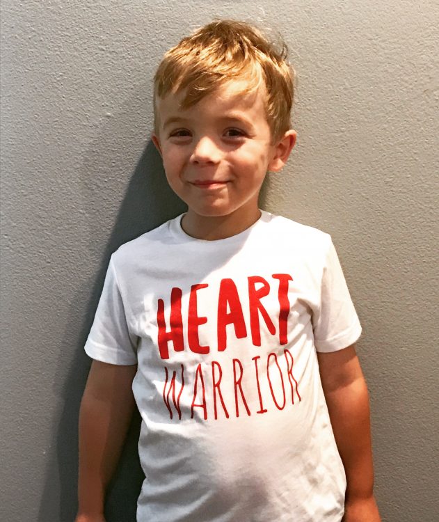 The writer's young son wearing a shirt that says, "Heart Warrior."