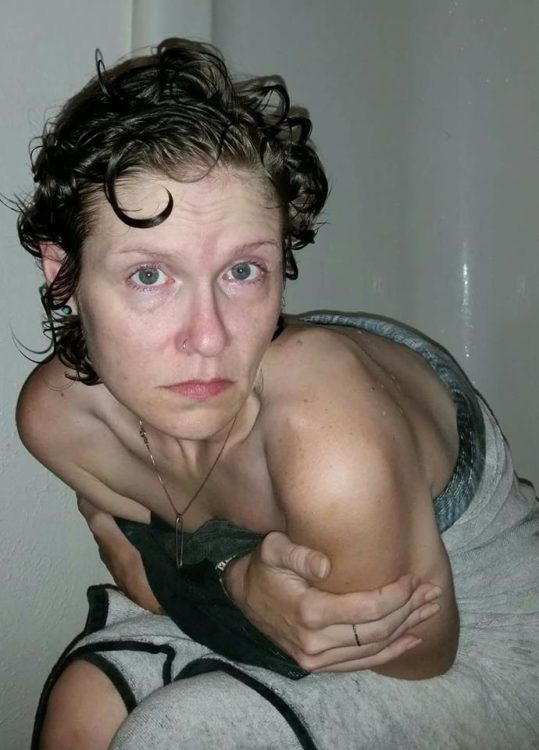 woman sitting down after taking a shower