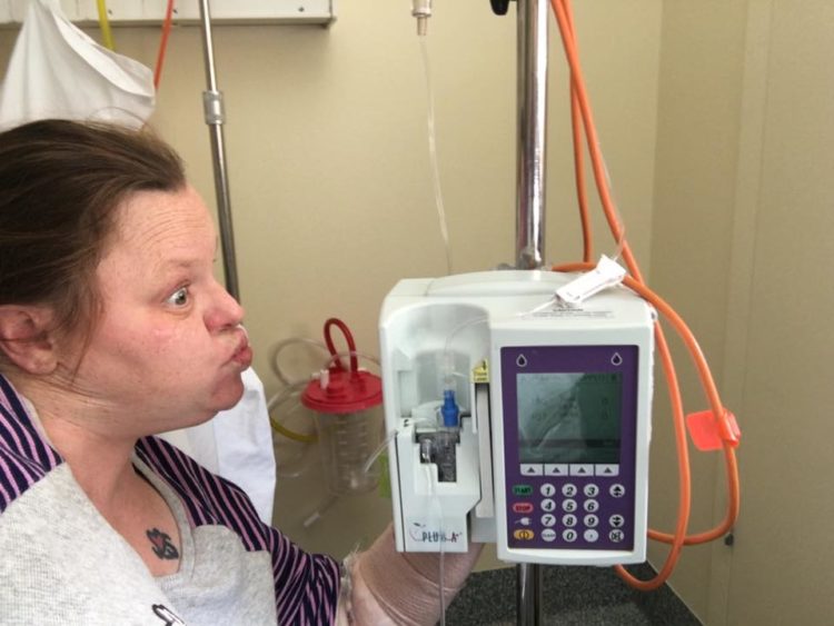 woman making a silly face at her monitor in the hospital