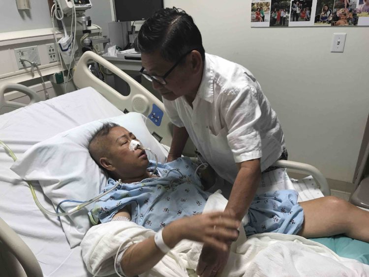Helen Huynh in hospital with husband