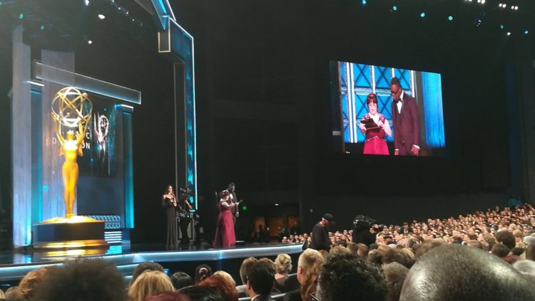 Screen shot of Rachel and John presenting at the Emmys