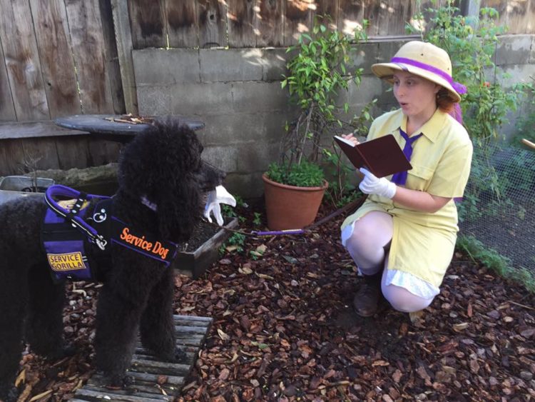 woman and her service dog dressed up as Jane (from Tarzan) and a gorilla