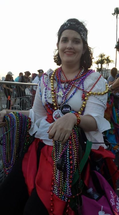 woman sitting on a walker and dressed as a pirate