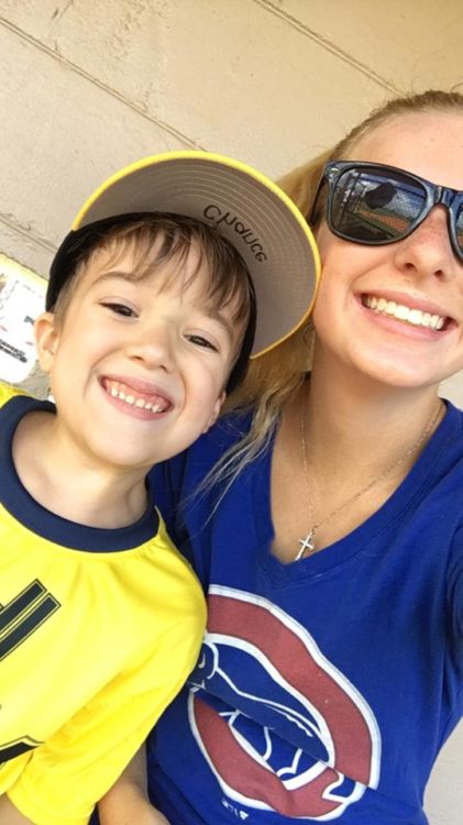 sister and brother smiling at camera