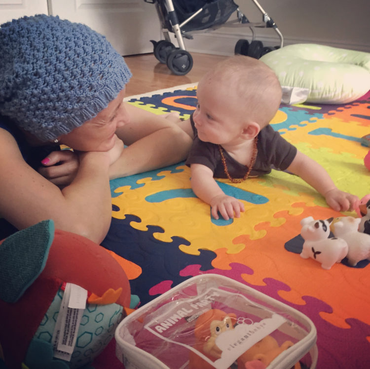 Jessica Sliwerski playing with Penelope on playmat